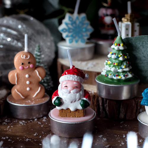 Santa Claus Candle, Christmas Tree Candle, Snow Flakes Candle and Gingerbread men Candle from 12 Days of Christmas Candle Advent Calendar from Southlake Gifts Canada.