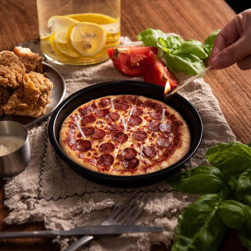 Lighting up the pizza candle