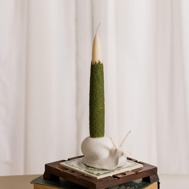Enhance your candle home decor: Add sophistication and beauty with the Moss Taper Candle and Snail Candle Holder Set. This exquisite set handmade in-house by Southlake Gifts Canada features a natural moss-textured taper candle and an intricately designed snail candle holder.