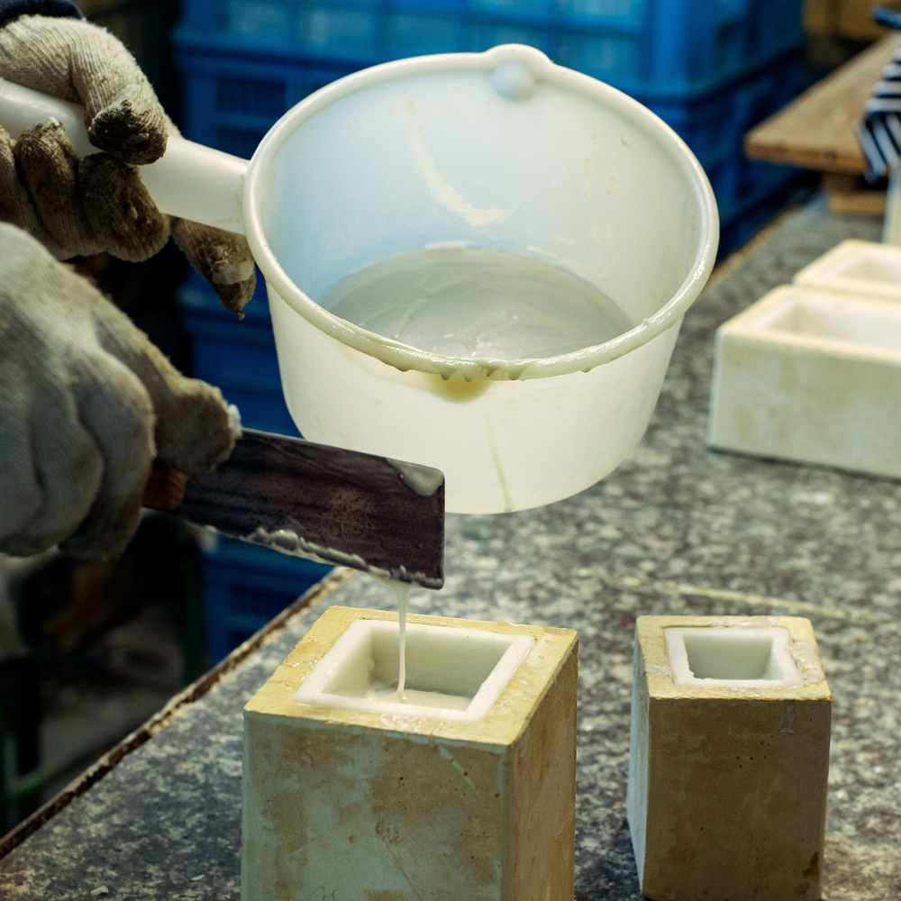 Southlake Gifts Canada candle pouring process by hand, showcasing the hand-poured candle.   