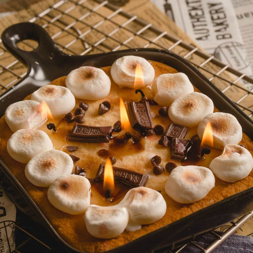 Decorative Skillet Candle - Chocolate and Marshmallow S&#39;more - Elevate your ambiance with the realistic chocolate, marshmallow, cookie, and chocolate wax decorations of this skillet candle from Southlake Gifts Canada