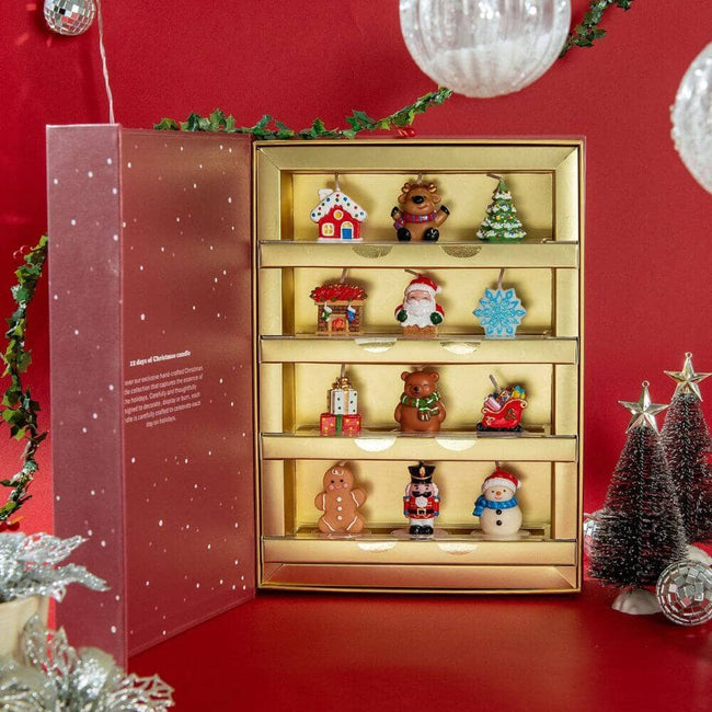 12 days candle advent calendar by Southlake Gifts Canada. Including a snow house, deer, Christmas tree, fire place, Santa Claus, Snow flake, Gift box, bear, sleigh, gingerbread man, snow man and walnut cracker