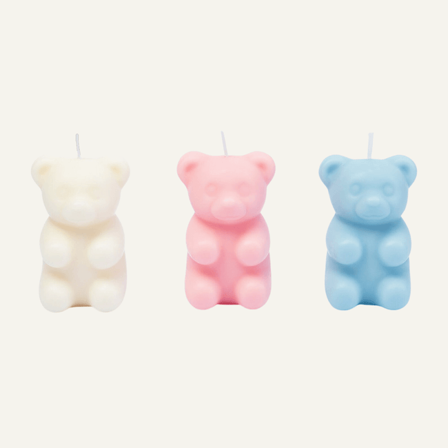 Decorative Gummy Bear Candle - Brighten up your living space with the charm of this adorable Gummy Bear Candle. With three colors of gummy bears (white, blue, and pink) and a hidden surprise inside, it adds a playful touch to your home decor. Available at Southlake Gifts Canada