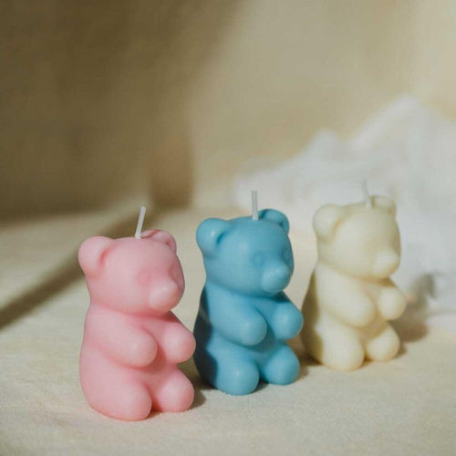 Gummy Bear Candle - Add some fun and sweetness to your space with this whimsical candle featuring three colors of gummy bears (white, blue, and pink). Plus, you&#39;ll uncover a surprise hidden inside once you burn it! Available at Southlake Gifts Canada