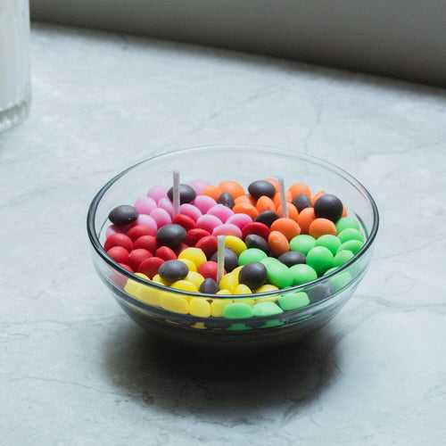 Candle Bowl - M&amp;M Rainbow Chocolate Scented - Add a pop of color to your decor with this enticing M&amp;M-themed candle bowl. The chocolate scent fills the air with a delicious aroma. Available at Southlake Gifts Canada