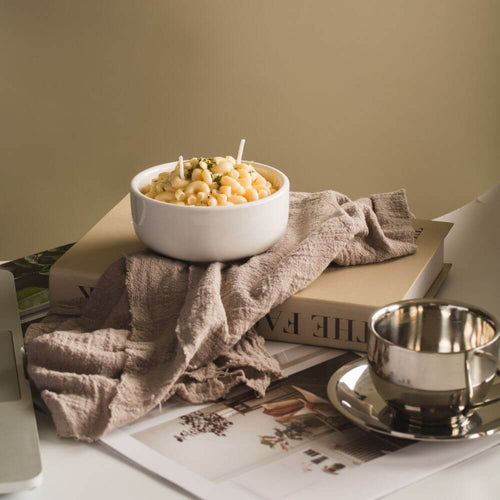 This handmade mac and cheese candle comes in a porcelain bowl and smells just like the real thing.