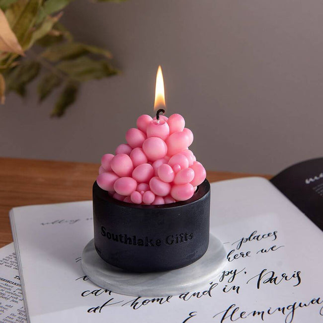 Transform your mood and create a calming ambiance with the Pink Moonstone Succulent Candle from Southlake Gifts Canada.