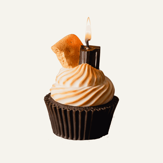 S'more Cupcake Scented Candle - Indulge in the mouthwatering fragrance of this irresistible candle. The realistic graham crackers, chocolate, and marshmallow cream puff design bring the essence of a decadent S'more cupcake right into your home. Available at Southlake Gifts Canada