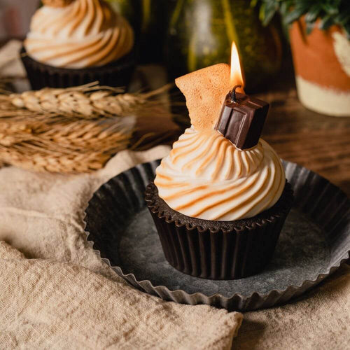 S&#39;more Cupcake Candle - Treat yourself to the enticing scent of this delightful candle, featuring realistic graham crackers and chocolate nestled on a marshmallow cream puff. Available at Southlake Gifts Canada