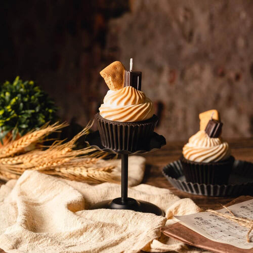 Candle - S&#39;more Cupcake Scented - Create a cozy and nostalgic ambiance with this S&#39;more Cupcake Candle. The realistic graham crackers, chocolate, and marshmallow cream puff design adds a touch of sweetness to any space. Available at Southlake Gifts Canada