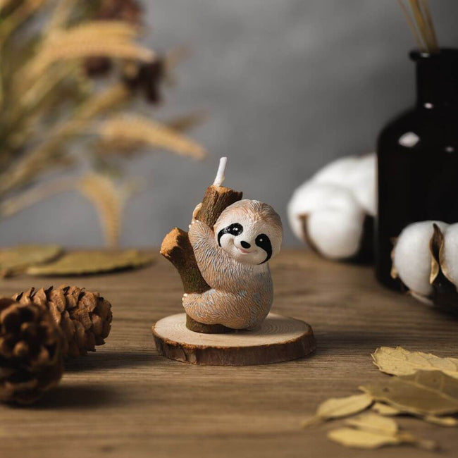 A beautifully made candle featuring an adorable image of a sloth from Southlake Gifts Canada