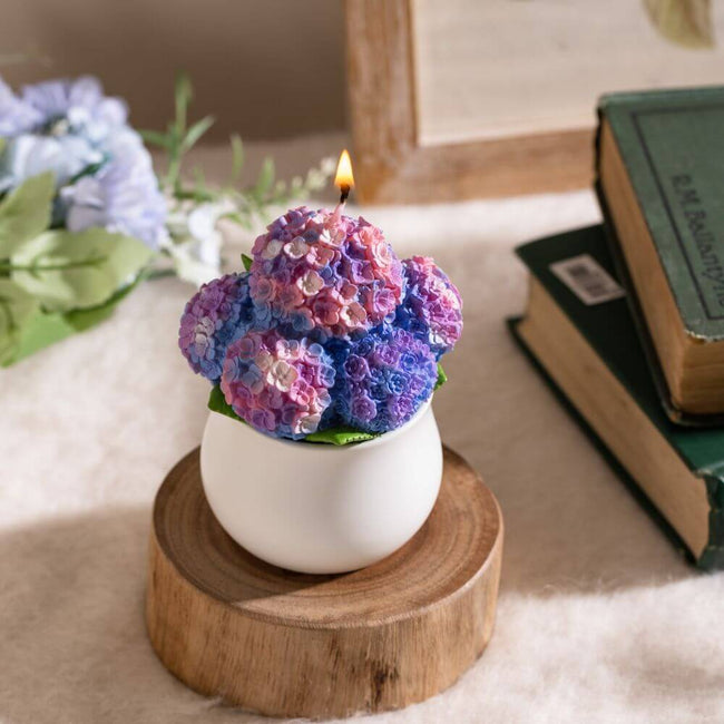 Experience the charm of indoor greenery with the realistic Hydrangea Candle from Southlake Gifts Canada
