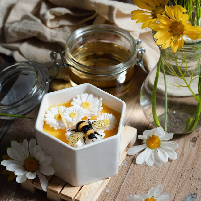 The Spring Blossom Candle Bowl featuring a bumblebee gathering nectar and daisies float from Southlake Gifts Canada.