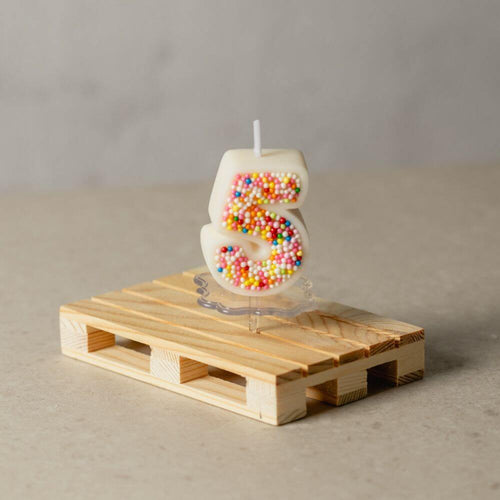 The number 5 Sprinkle Candy Number Candle from Southlake Gifts Canada to add as a cake topper for your celebration .
