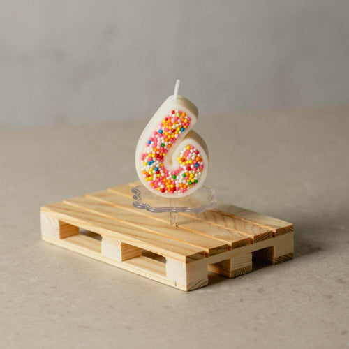 The number 6 Sprinkle Candy Number Candle from Southlake Gifts Canada to add as a cake topper for your celebration .