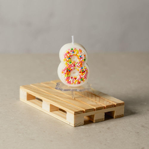 The number 8 Sprinkle Candy Number Candle from Southlake Gifts Canada to add as a cake topper for your celebration .