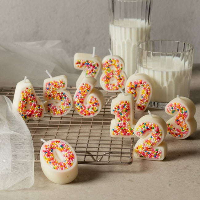 The Sprinkle Candy Number Candle Set sprinkled coated with colorful numbers from from Southlake Gifts Canada.