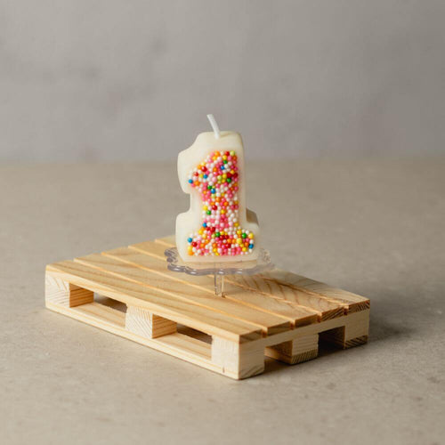 The number 1 Sprinkle Candy Number Candle from Southlake Gifts Canada to add as a cake topper for your celebration .
