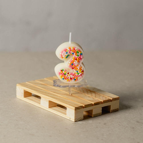 The number 3 Sprinkle Candy Number Candle from Southlake Gifts Canada to add as a cake topper for your celebration .